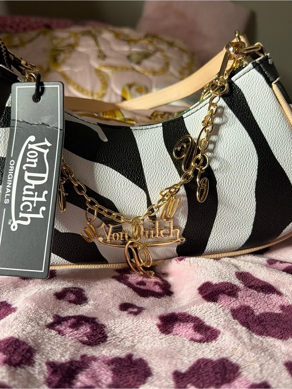 Von Dutch Rose Gold Charm Zebra Shoulder Bag in Black and White